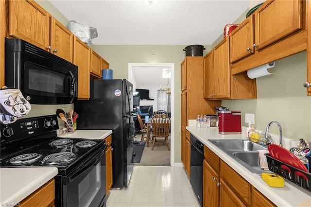 kitchen featuring sink and black appliances