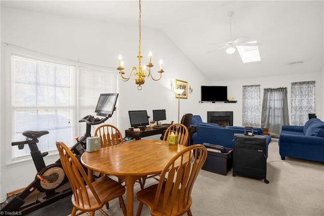 dining area featuring ceiling fan and vaulted ceiling