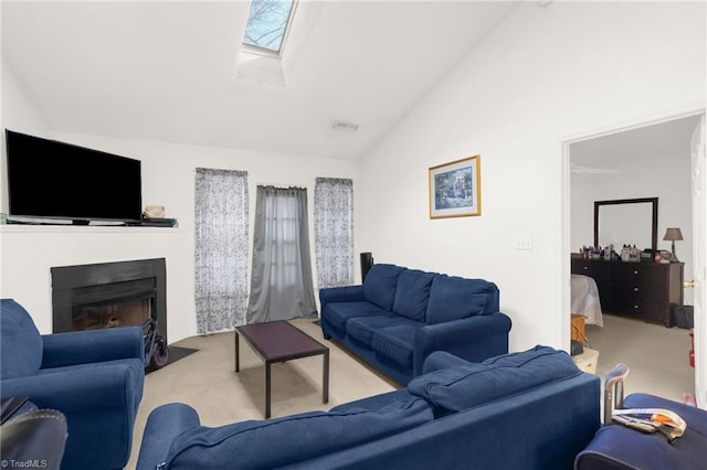 carpeted living room with a skylight and high vaulted ceiling