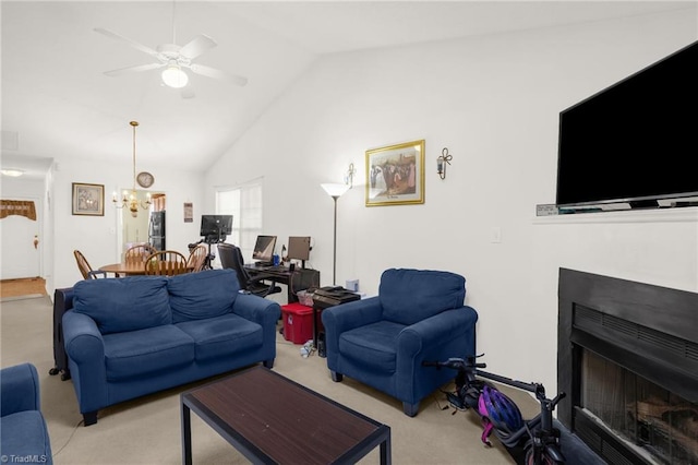 living room with lofted ceiling, ceiling fan with notable chandelier, and light carpet