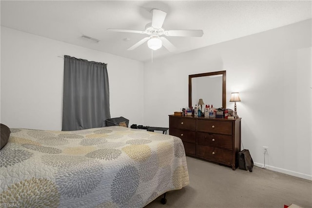 bedroom with light carpet and ceiling fan