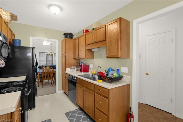 kitchen with sink and black appliances