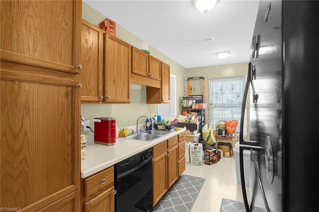 kitchen with sink and black appliances