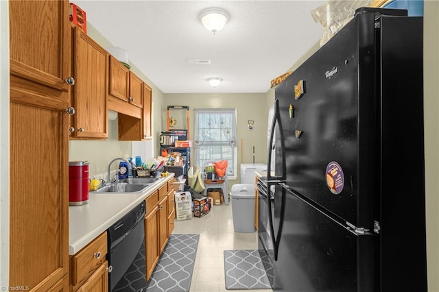 kitchen with sink and black appliances