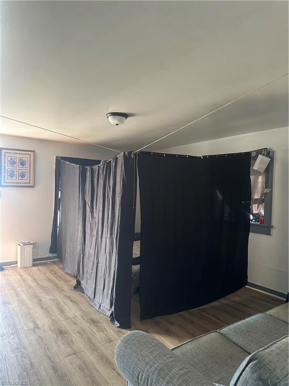 bedroom featuring wood-type flooring