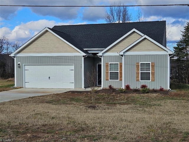 view of front of house featuring a garage and a front yard