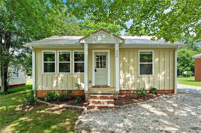 502 Eighth St, Mebane, NC 27302 - bungalow featuring board and batten siding and a metal roof