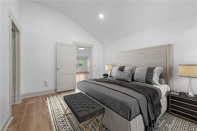 502 Eighth St, Mebane, NC 27302 - bedroom featuring light wood finished floors, high vaulted ceiling, and recessed lighting