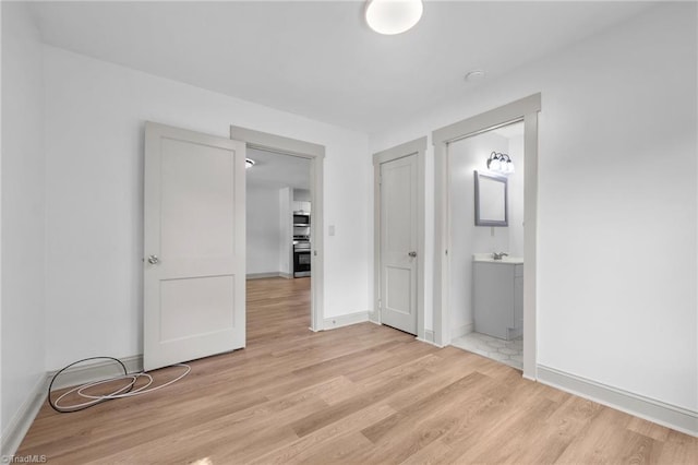 502 Eighth St, Mebane, NC 27302 - unfurnished bedroom featuring light wood-style flooring and ensuite bathroom