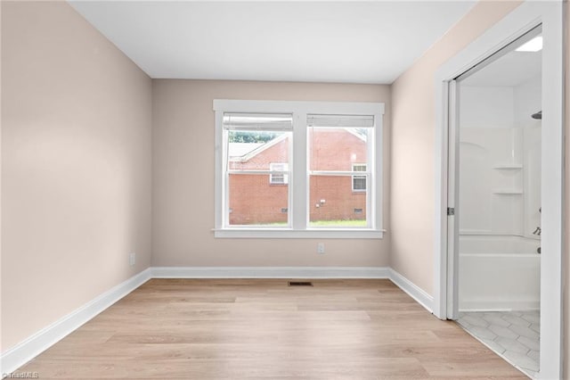 502 Eighth St, Mebane, NC 27302 - empty room with light wood-style floors and baseboards