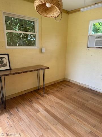 502 Eighth St, Mebane, NC 27302 - empty room featuring cooling unit and light wood finished floors