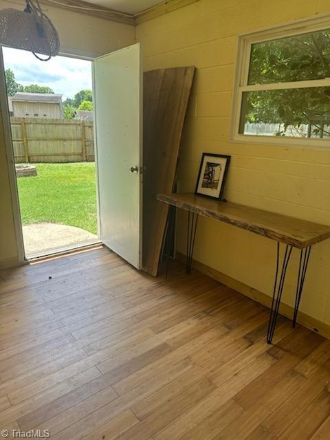 502 Eighth St, Mebane, NC 27302 - doorway to outside featuring light wood-type flooring