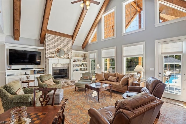 living room featuring beamed ceiling, a brick fireplace, high vaulted ceiling, and ceiling fan