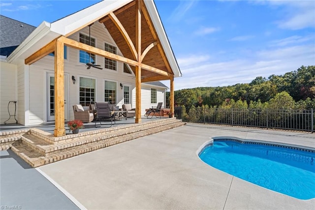 view of swimming pool with a patio and an outdoor living space