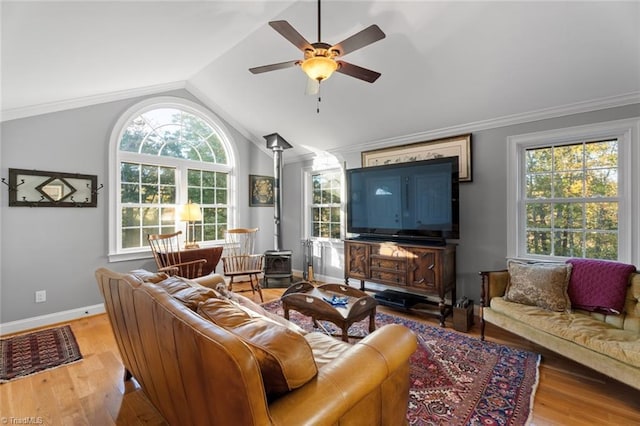 living room with lofted ceiling, light hardwood / wood-style floors, a healthy amount of sunlight, and ceiling fan