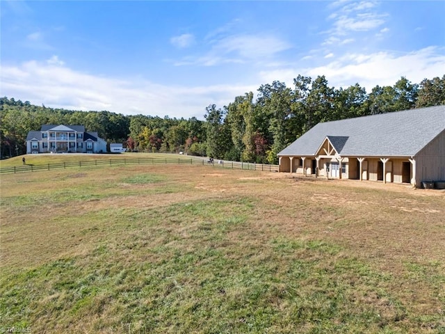 view of yard with a rural view