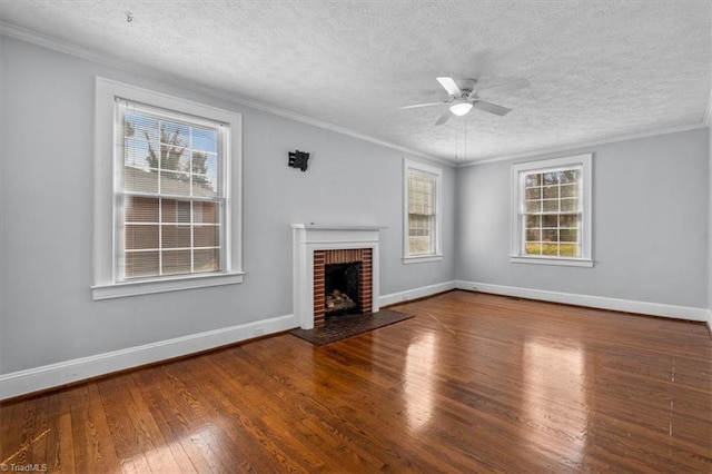 unfurnished living room with hardwood / wood-style flooring, a fireplace, and ornamental molding