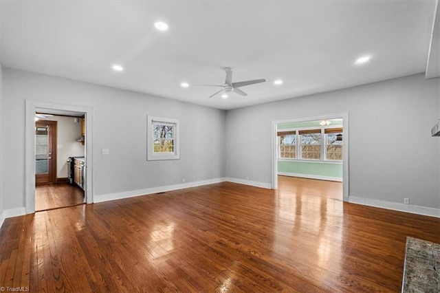 unfurnished living room with recessed lighting, baseboards, wood-type flooring, and ceiling fan