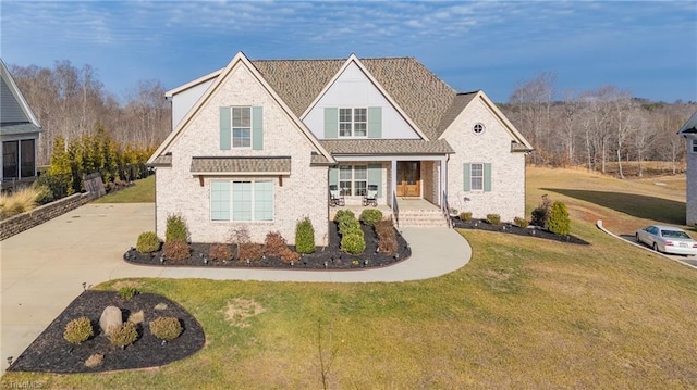 view of front facade with a front yard and a porch