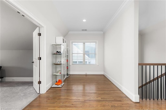 interior space featuring ornamental molding and wood-type flooring