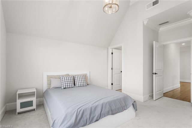 carpeted bedroom featuring ornamental molding and a chandelier