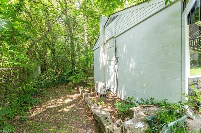 view of side of property featuring concrete block siding