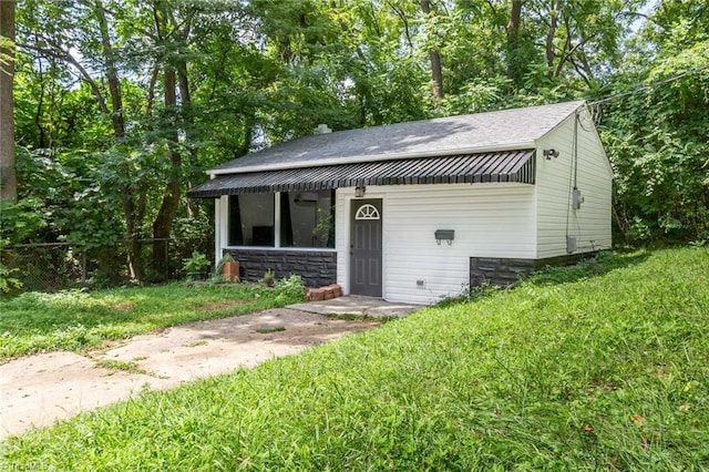 view of outbuilding with fence