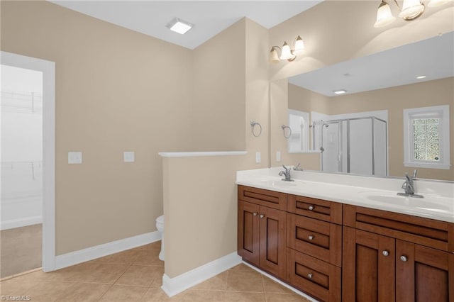 bathroom featuring an enclosed shower, vanity, tile patterned floors, and toilet