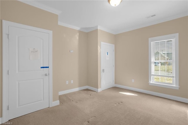 carpeted spare room with ornamental molding