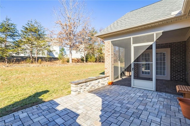 view of patio / terrace with a sunroom