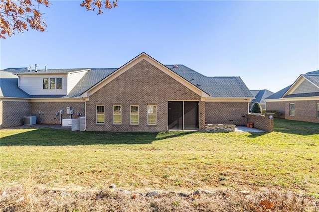 rear view of house featuring a yard and cooling unit