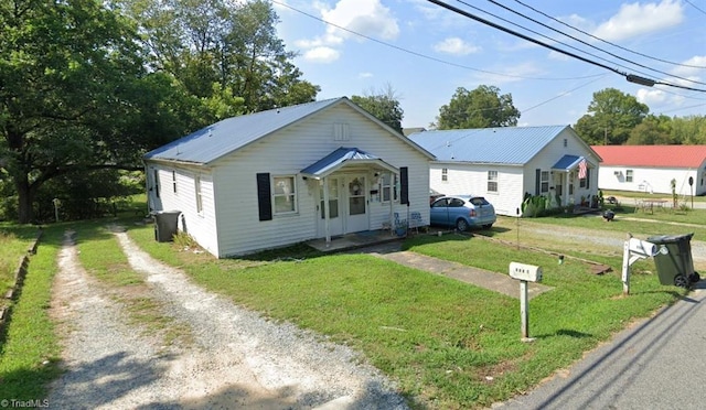 bungalow-style house with a front yard