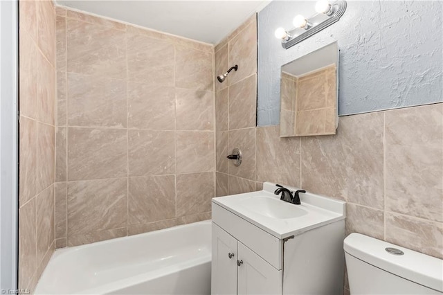 415 White Oak St, High Point, NC 27260 - full bathroom featuring vanity, bathing tub / shower combination, and tile walls