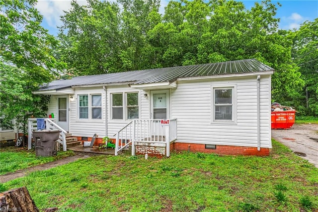 415 White Oak St, High Point, NC 27260 - view of front of home with crawl space, a metal roof, and a front yard