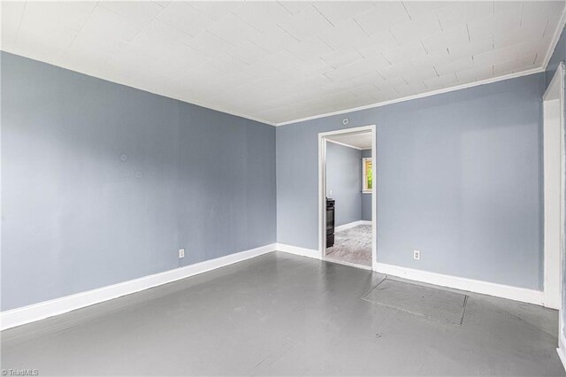 415 White Oak St, High Point, NC 27260 - spare room featuring concrete floors and ornamental molding