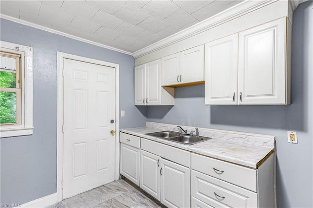 415 White Oak St, High Point, NC 27260 - kitchen with crown molding, light countertops, white cabinets, and light marble finish floors