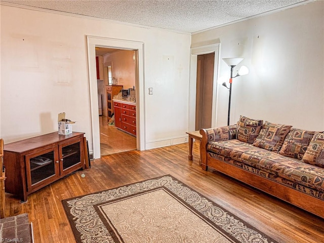 living room featuring hardwood / wood-style floors and a textured ceiling