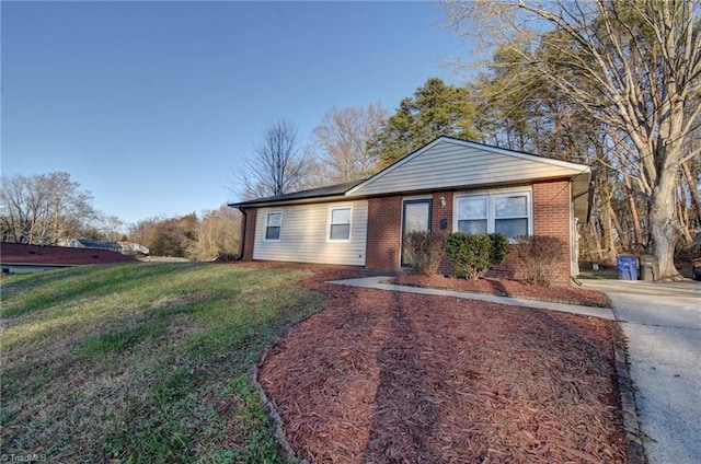 ranch-style home with a front lawn