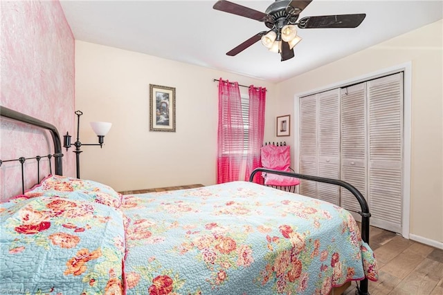 6517 Benson Ln, Pfafftown, NC 27040 - bedroom with wood finished floors, a ceiling fan, and a closet