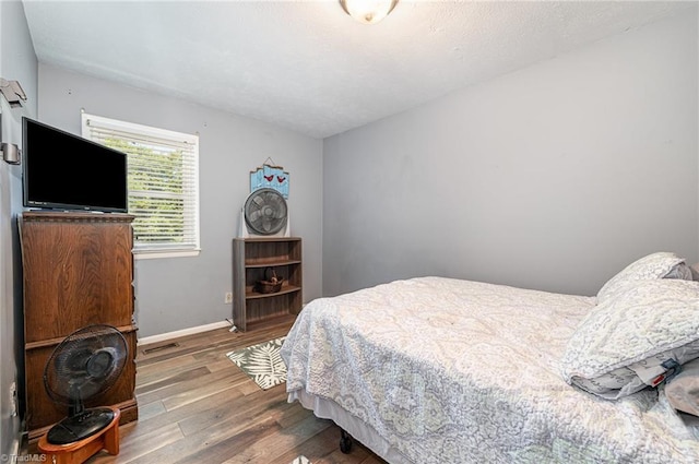 6517 Benson Ln, Pfafftown, NC 27040 - bedroom featuring wood finished floors and baseboards