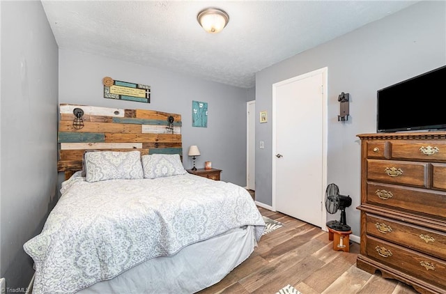 6517 Benson Ln, Pfafftown, NC 27040 - bedroom with wood finished floors and baseboards