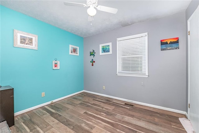 6517 Benson Ln, Pfafftown, NC 27040 - unfurnished room featuring wood finished floors and ceiling fan