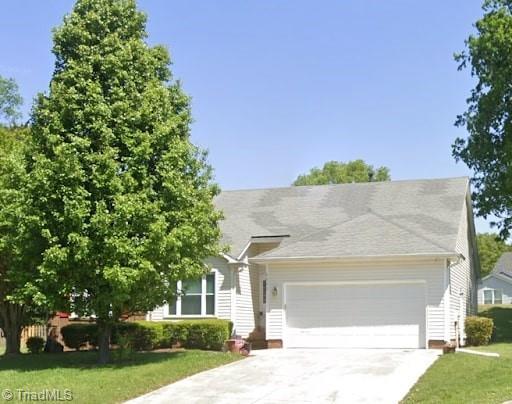 2800 Chillon Ct, Greensboro, NC 27407 - view of front facade with a garage, concrete driveway, and a front lawn
