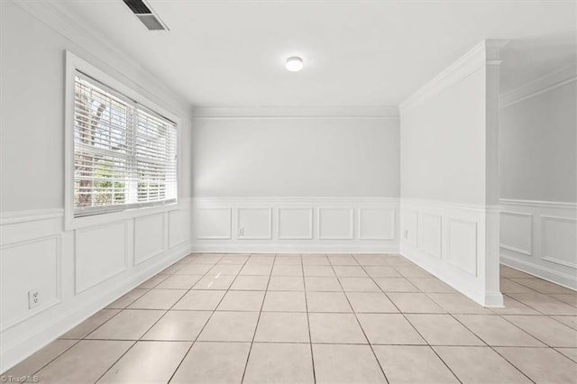 3523 Riverside Dr, Greensboro, NC 27406 - empty room featuring ornamental molding and light tile patterned floors