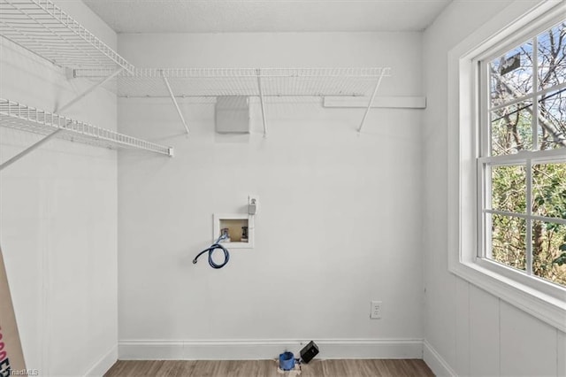 3523 Riverside Dr, Greensboro, NC 27406 - laundry room featuring baseboards, wood finished floors, and washer hookup