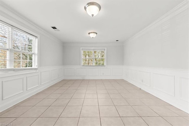 3523 Riverside Dr, Greensboro, NC 27406 - unfurnished room with light tile patterned floors, crown molding, and visible vents