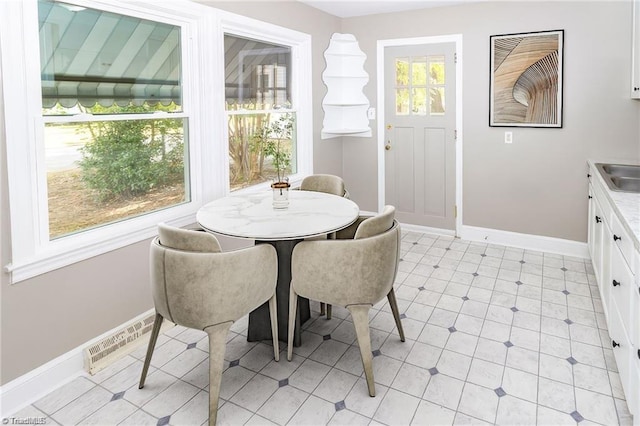 sunroom featuring sink