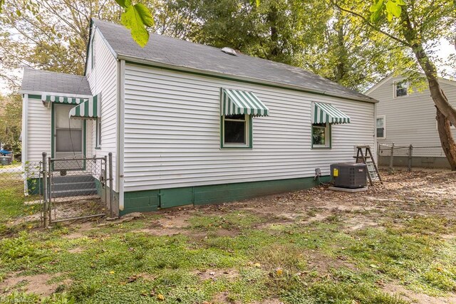 view of side of property featuring cooling unit