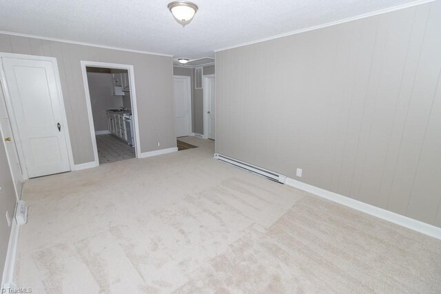 unfurnished bedroom with a baseboard radiator, ornamental molding, light colored carpet, and ensuite bathroom