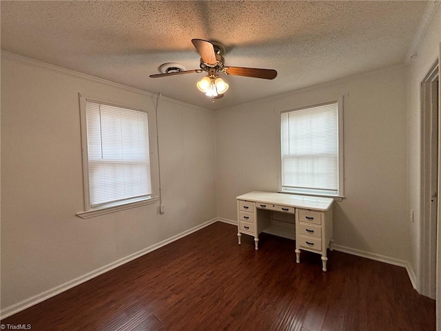 unfurnished office featuring ceiling fan, dark hardwood / wood-style floors, a textured ceiling, and ornamental molding